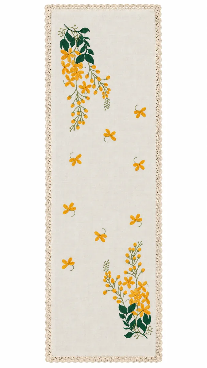 Table runners: Trailing yellow flowers and green leaves on an ivory, lace-edged runner.